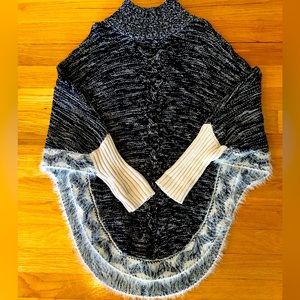 Girls Black/Cream Tweed Cape with Sleeves. And decorative trim accents.